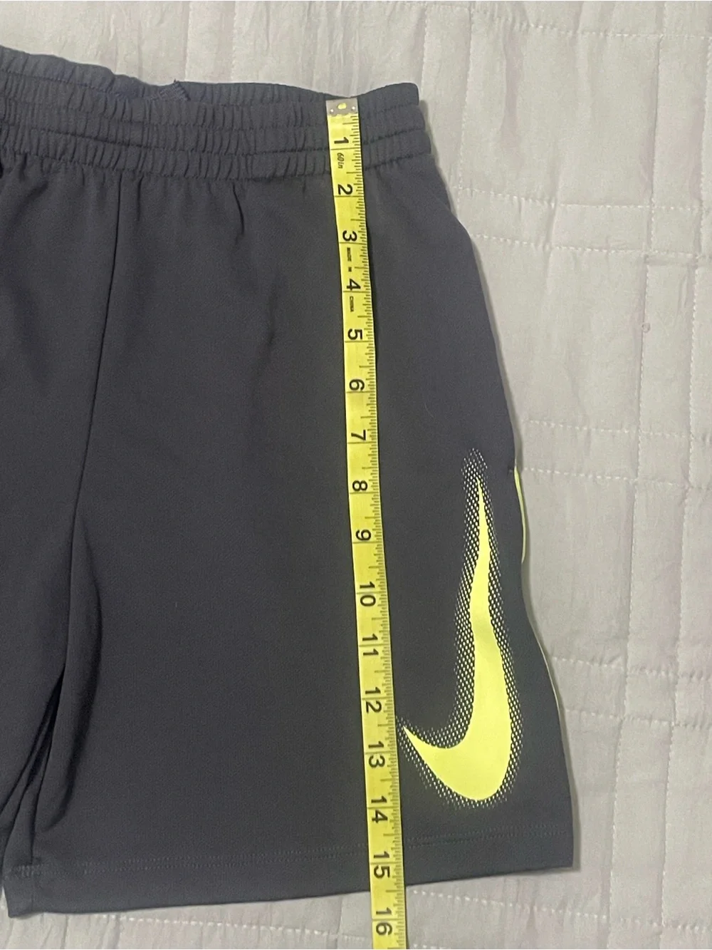 Nike Kids Black Athletic Shorts with Neon Yellow Swoosh